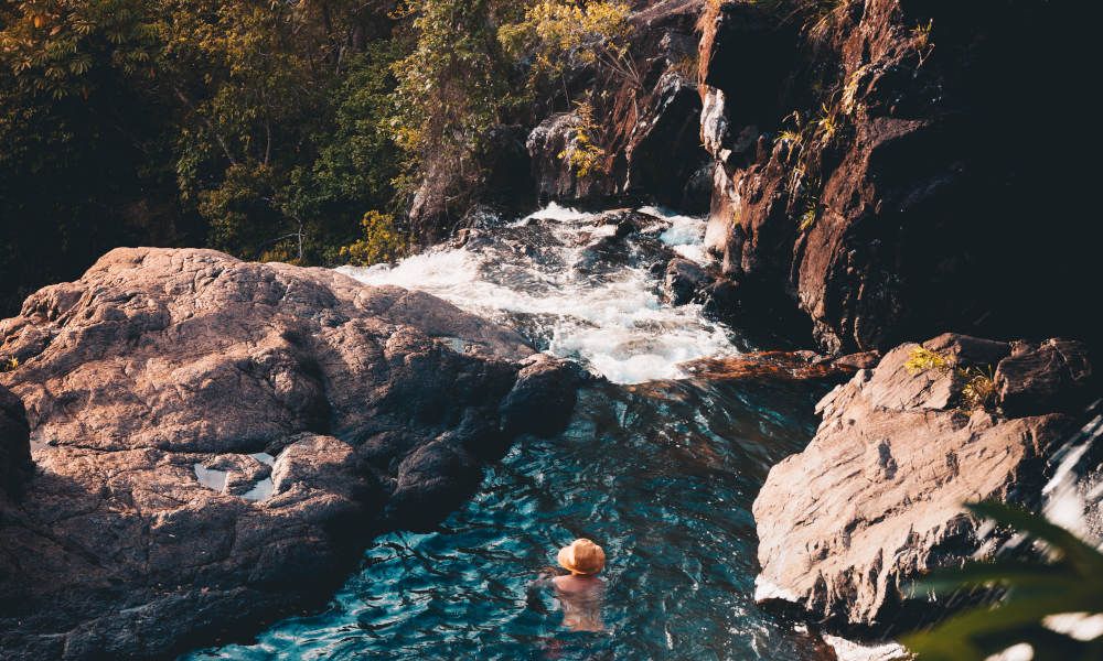 A fun guided eco-walk to the top of Cedar Creek Falls near Arlie Beach.