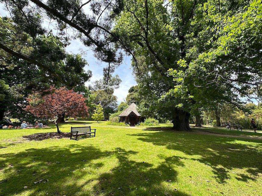 The expansive grass lawn, flower gardens, a lake with ducks and beautiful walking paths at Rippon Lea House and gardens in Melbourne.